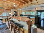 Kitchen with Copper Wrap-around Bar with seating for 7